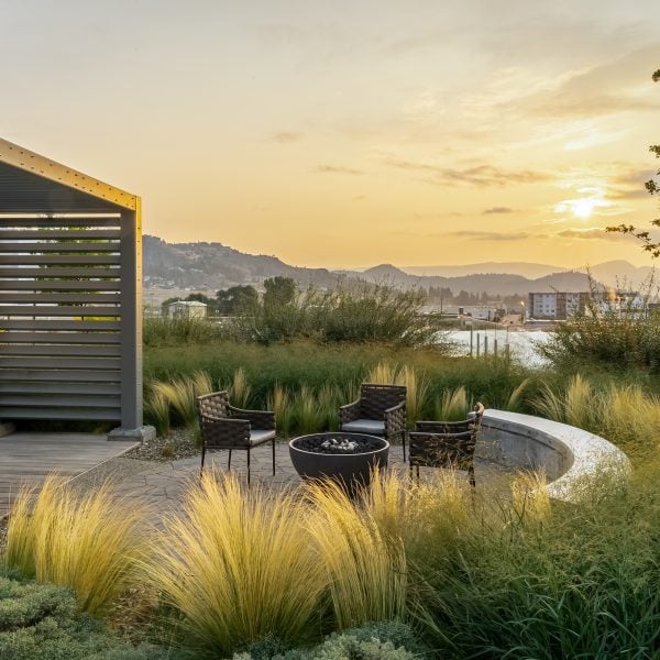 One Water Street - HEMI 36 firepit in Cinder - Kelowna BC - Patio - at dusk unlit